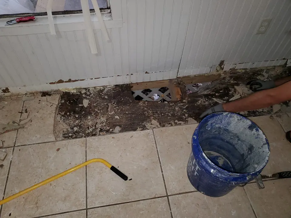 Rotted floor opened to the subfloor during a Knight Group repair in Pinellas County