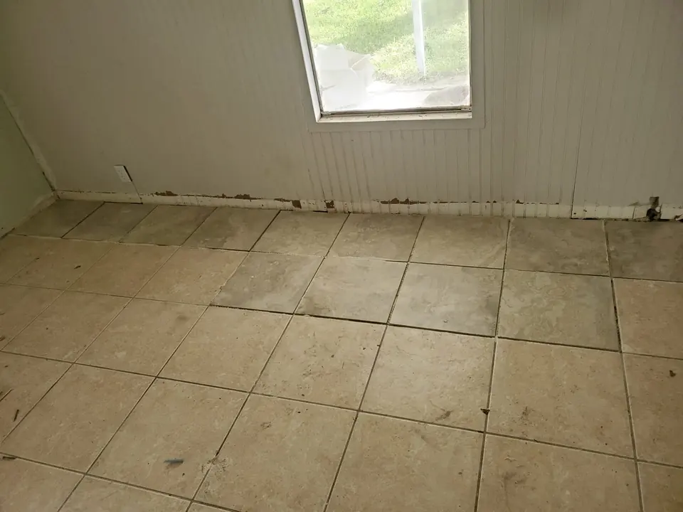 Floor and base trim opened for a subfloor repair — Knight Group job in Pinellas County